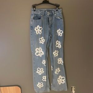 Blue jeans with white flower design size 26
